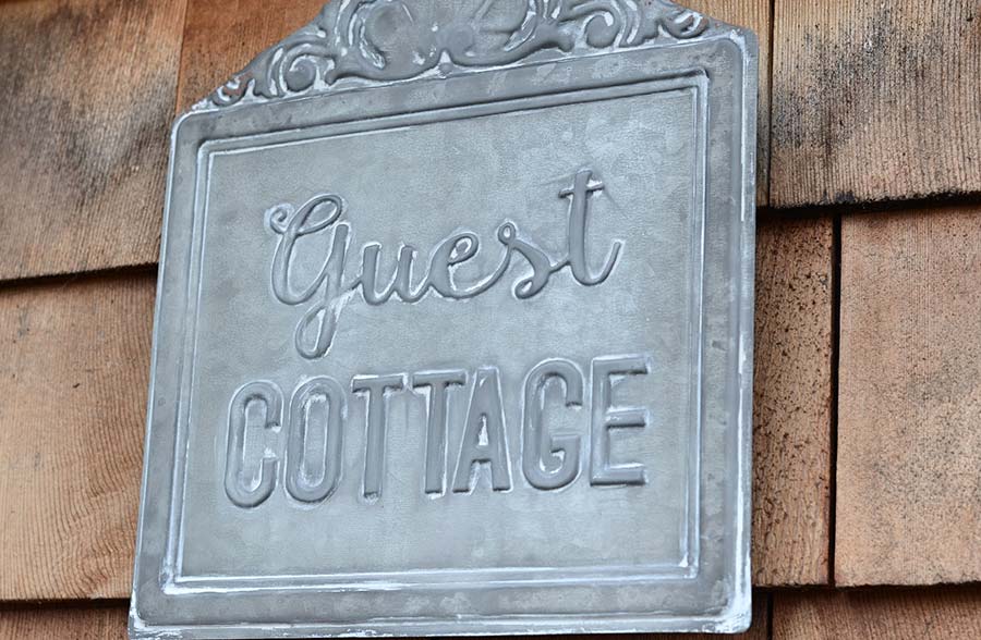 Guest Cottage Embossed Tin Sign